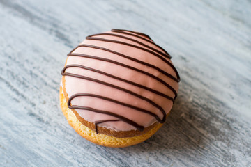 Top view of glazed biscuit. Cookie sandwich on gray background. Bush cake with great flavor. Sweet delicacy for dessert.