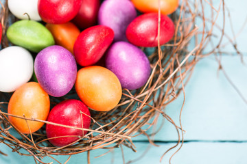 Easter concept with colorful eggs on wooden background