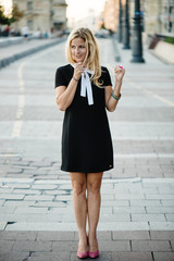Blonde woman pretending a public announcement