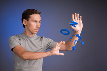 Man working with a set of letters, writing concept.