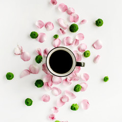 Fototapeta na wymiar Colorful bright image made of leaves, roses and petals with coffee cup on white. flat lay, top view