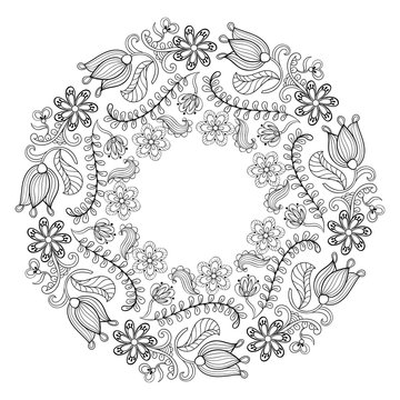 Zentangle stylized floral wreath. Freehand boho sketch for adult