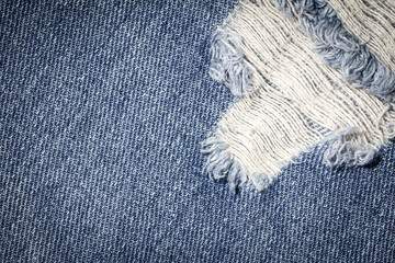 Fototapeta na wymiar Denim jeans texture or denim jeans background with old torn. Old grunge vintage denim jeans. Stitched texture denim jeans background of jeans fashion design.