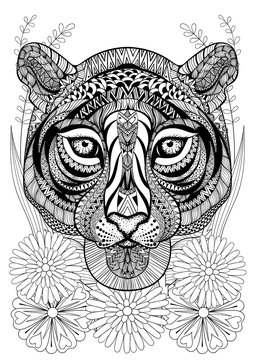 Zentangle stylized tiger face on flowers. Hand drawn ethnic anim