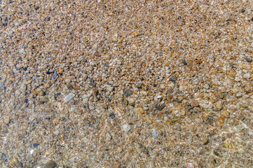 Sea pebble stone and wave background