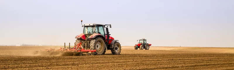 Light filtering roller blinds Tractor Farmer in tractor preparing land with seedbed cultivator