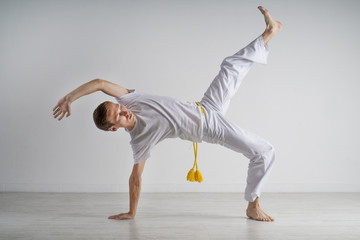Man practicing capoeira , brazilian martial art.