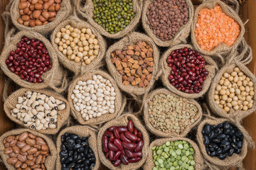 Various colorful dried legumes in sackcloth  for background