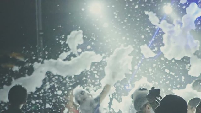 Foam Party at nightclub. Slow motion.