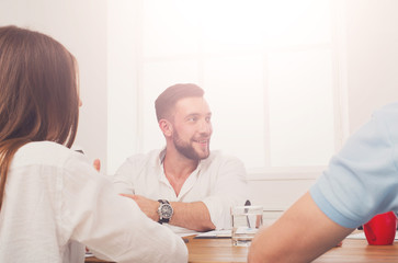 Obraz premium Business meeting. Young hipster businessman in modern office