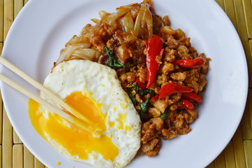 fried rice noodle and spicy minced pork with basil leaf topping egg