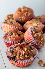 Homemade Nut Muffins cupcake on a wooden table, soft focus