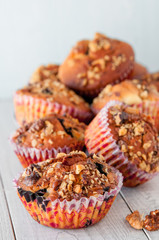 Homemade Nut Muffins cupcake on a wooden table, soft focus