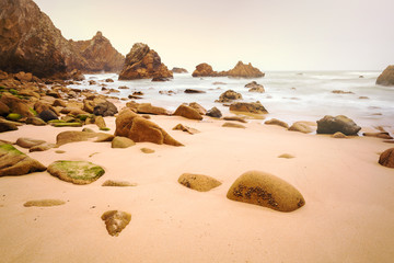 Isolated beach Ursa on Atlantic coast near the Cape Roca, Sintra, Portugal