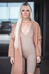 Blonde young girl posing outside