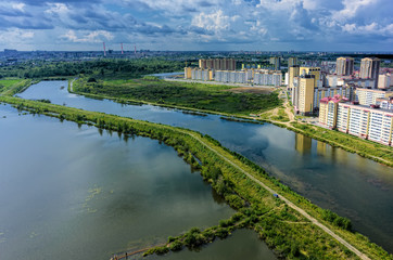 Naklejka premium Tyumen, Russia - July 29, 2015: Aerial view on Rowing channel, lake Quitrent and Tura neighborhood