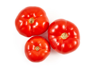 A tomato. Red tomato on a white background. Harvest vegetables. Autumn harvest. Red, juicy, ripe tomato.
