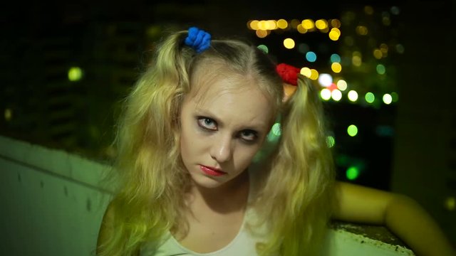 crazy girl. halloween. woman holds a finger across his throat