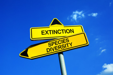 Extinction vs Species Diversity - Traffic sign with two options - appeal to protect, preserve and conserve endangered animals and plants. Richness and variety of nature and environment