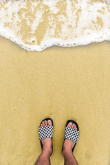 Fototapeta na wymiar Man feets at the beach