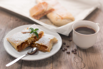 Traditional home made fresh apple strudel sprinkled with fine sugar