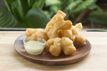 deep fried dough stick  with sweetened condensed milk