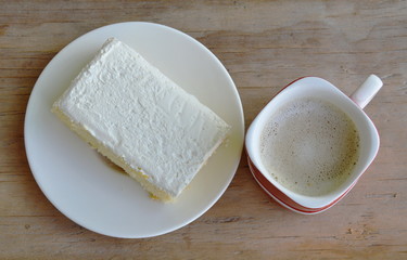 Fototapeta na wymiar vanilla flavor milk cream cake on dish and coffee
