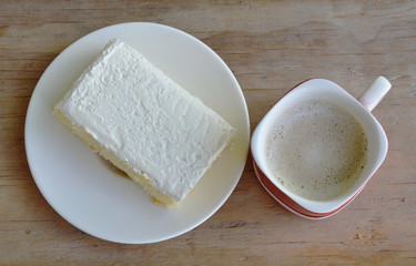 vanilla flavor milk cream cake on dish and coffee