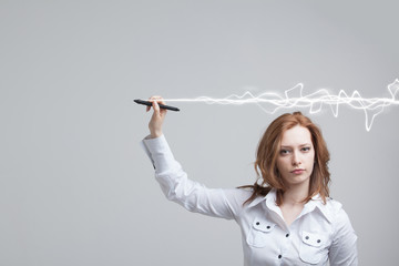 Woman making magic effect - flash lightning. The concept of copywriting or writing.