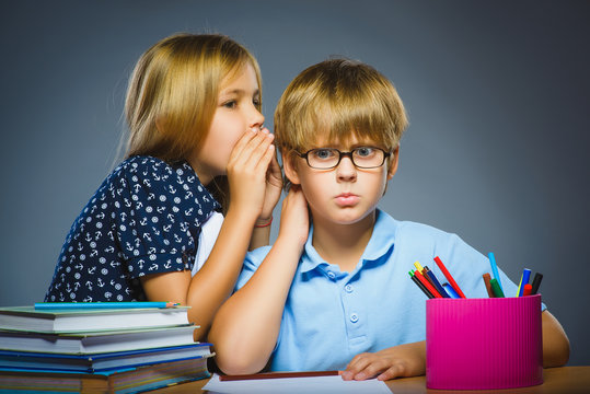 School Communication Concept. Girl Whispering In Ear Of Boy