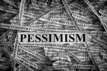 Torn pieces of paper with the word Pessimism