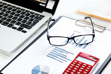 workplace economist at office table with laptop
