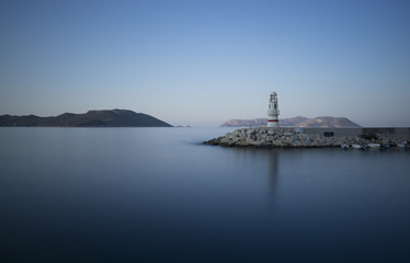 Fototapeta na wymiar Kas, Turkey. Lighthouse and Port. Dawn. Kastellorizo