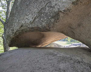 The concave base of a large boulder