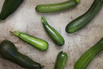 Fresh organic zucchini on the wooden table
