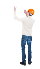 Back view of  pointing young men in helmet. Young guy  gesture. Rear view people collection.  backside view of person.  Isolated over white background. Foreman beckoning someone to her.