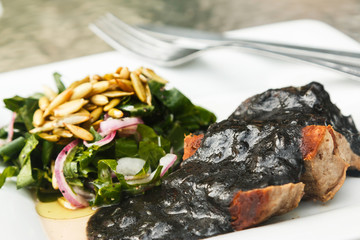 Beef meat and black sauce with beans
