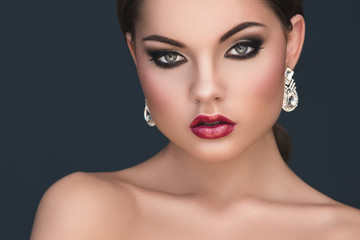 Young woman with beautiful earrings