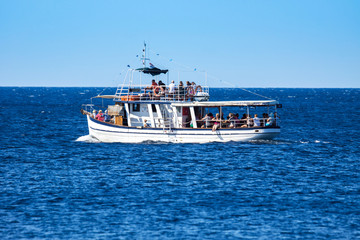 Fototapeta premium Typical touring boat on Adriatic sea, Croatia. August 23th, 2016