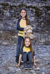 Cute little girl in a yellow skirt from the back