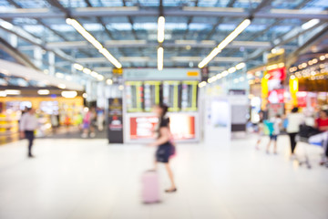 passenger look at the boarding time in airport with blur motion