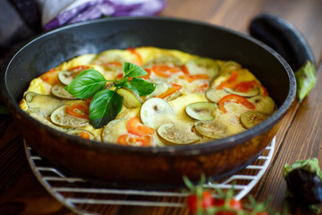 fried omelet with eggplant and tomatoes