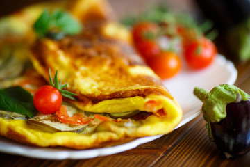 fried omelet with eggplant and tomatoes © Peredniankina