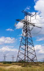 Electrical tower closeup against blue sky