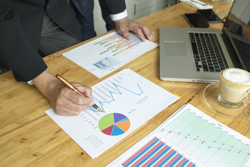 A businessman sign or discussing document or graph.Close up shot