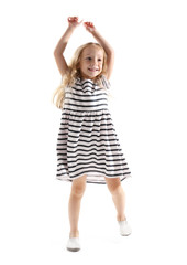 Cheerful little girl dancing on white background