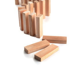 Wooden dominoes on light background