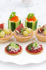 Assorted holiday mini appetizers, vertical, closeup