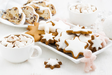 assortment gingerbread cookies, Christmas Stollen and hot cocoa