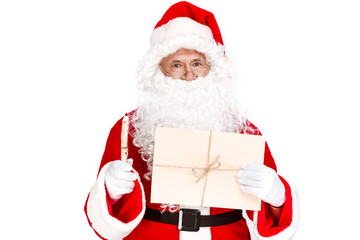 Write letter with your wishes to Santa Claus. Traditional Santa holding envelope and wooden pencil on white background
